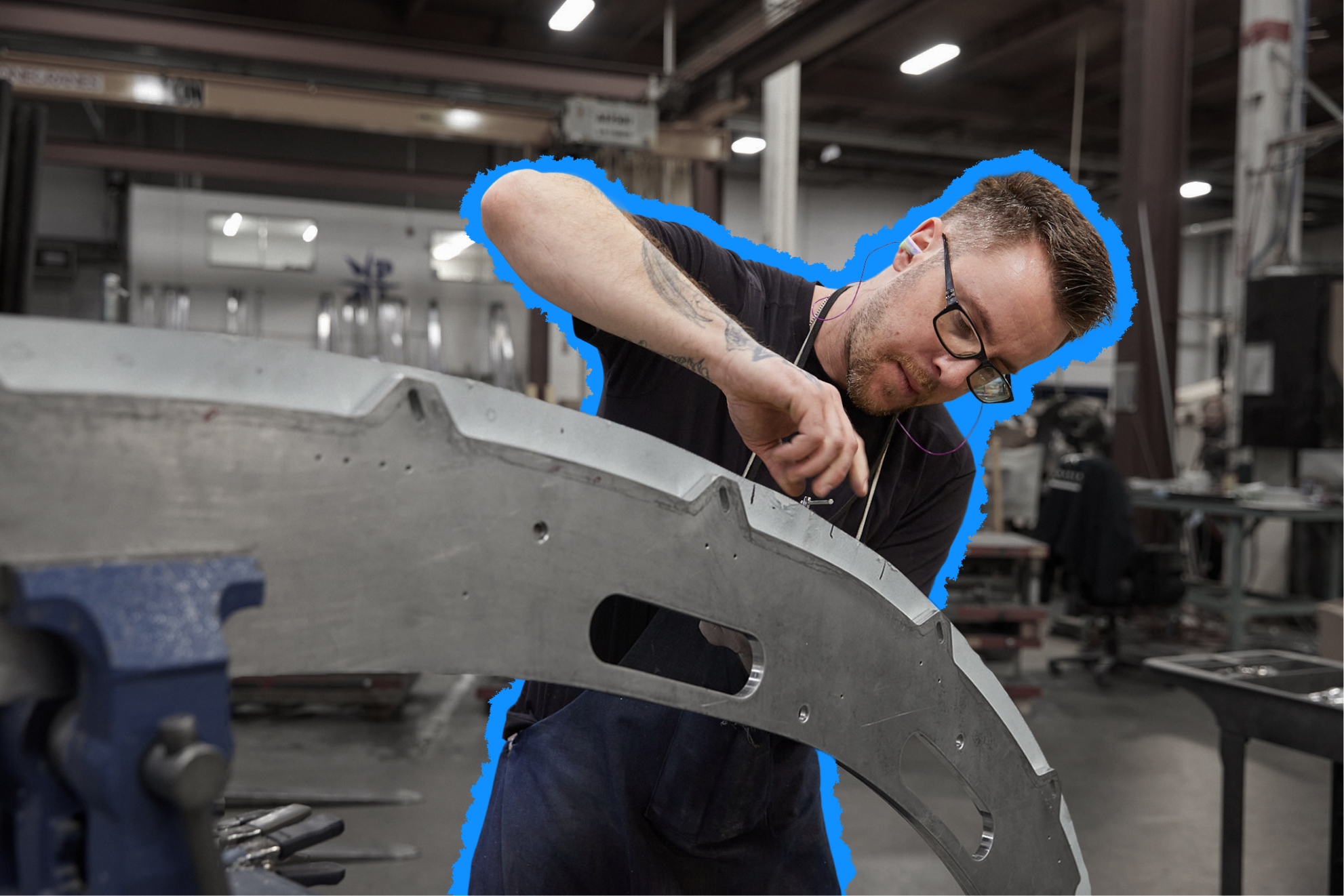 Man with a blue outline working in facility.